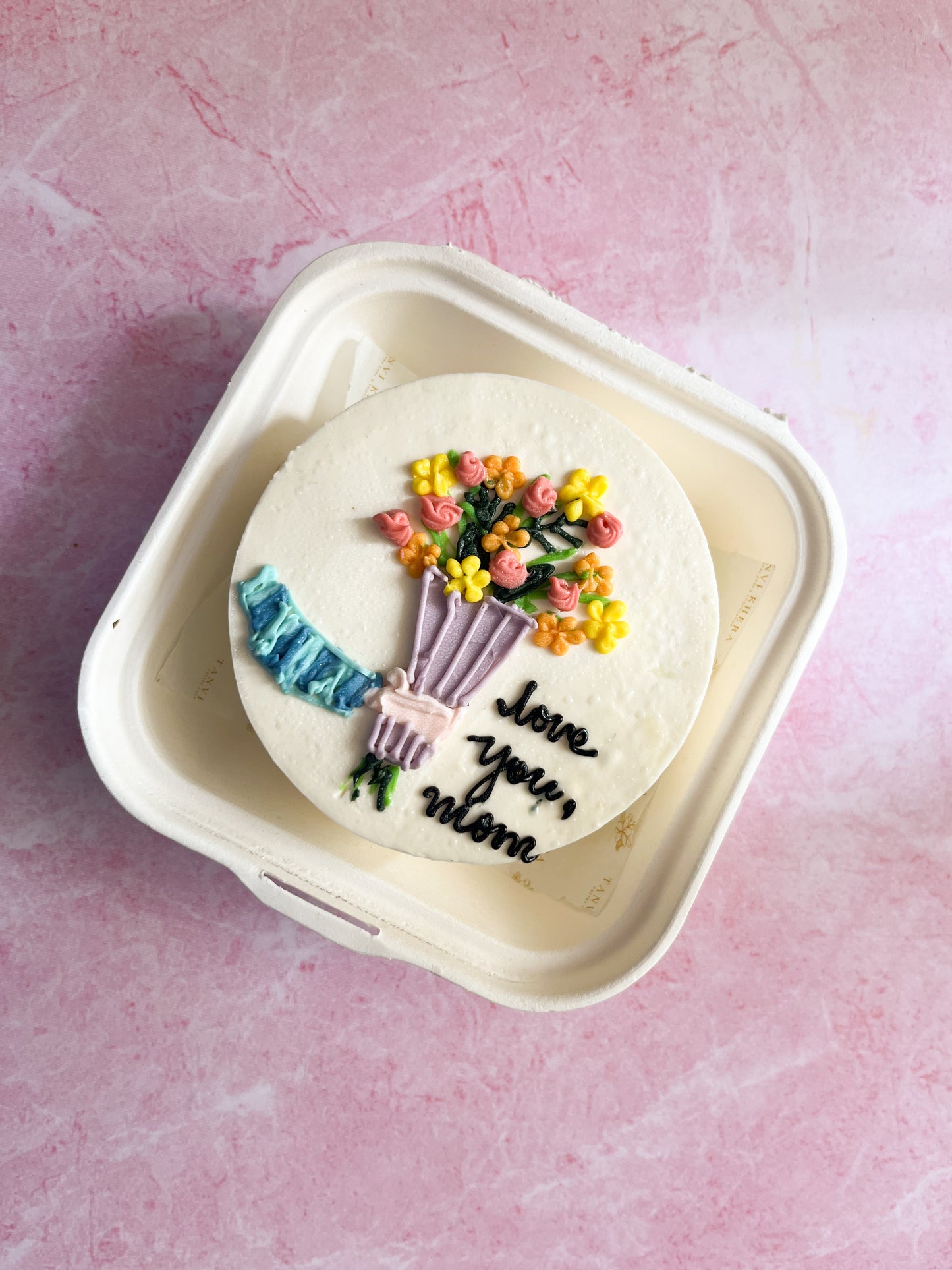 Hand holding Flower Bouquet Bento Cake
