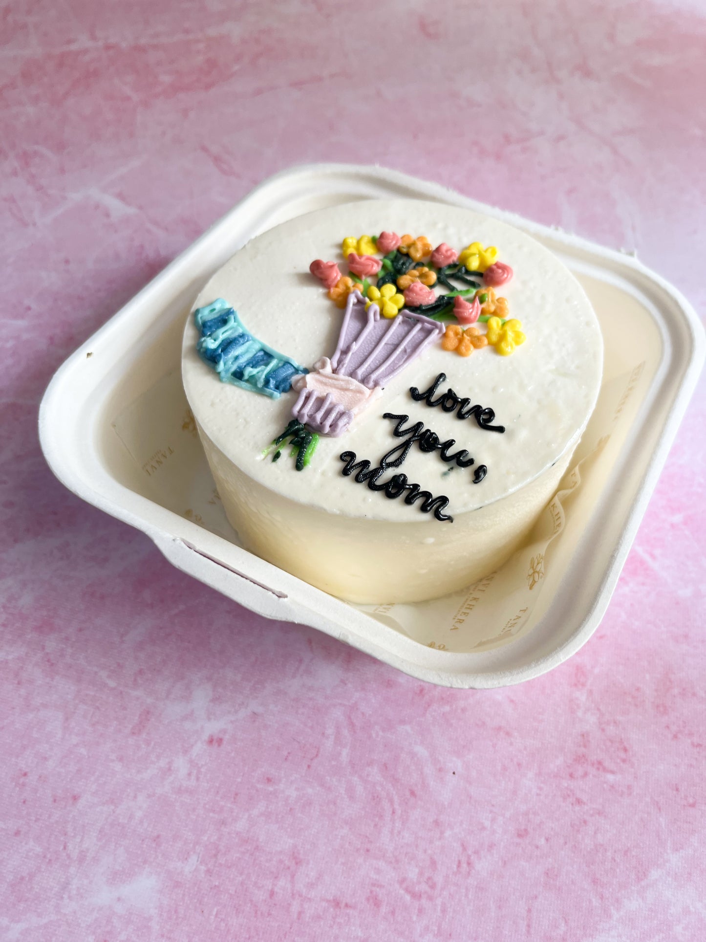 Hand holding Flower Bouquet Bento Cake