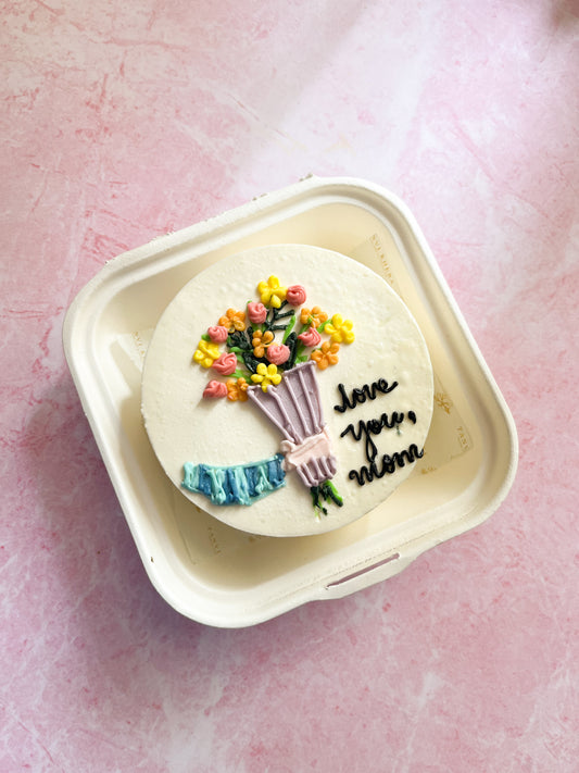 Hand holding Flower Bouquet Bento Cake