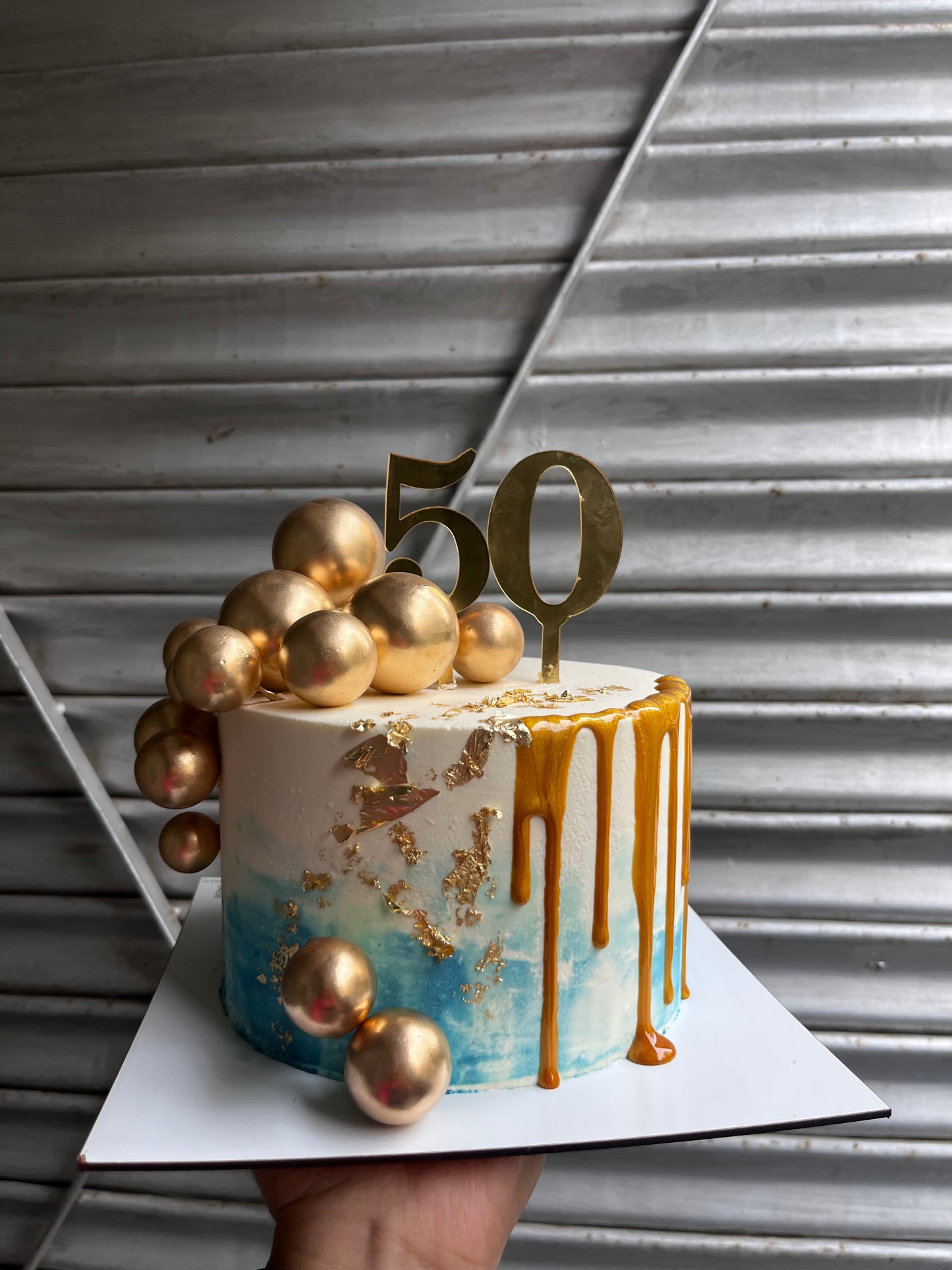 Blue and Gold with Drip Cake