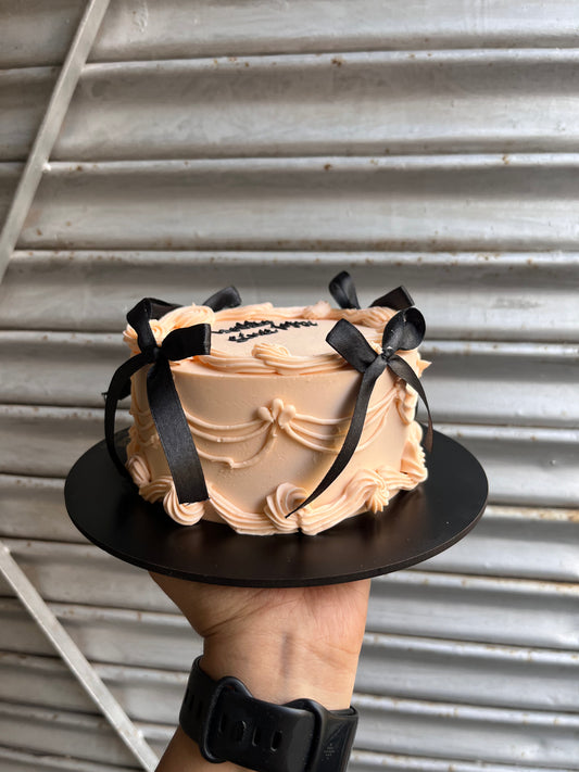 Pastel Peach Cake With Black Bow Victorian Cake