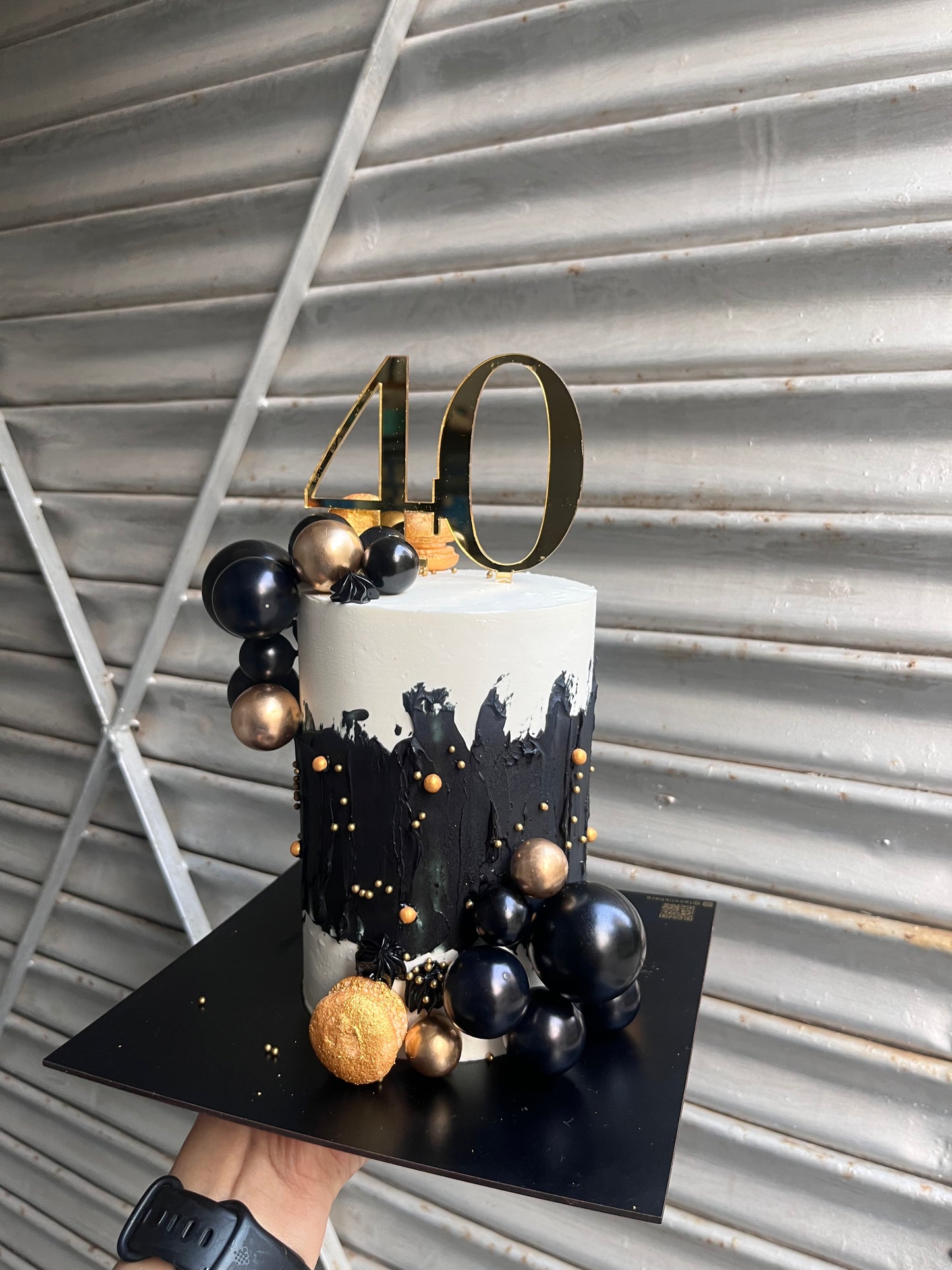 Tall Black and Gold Cake